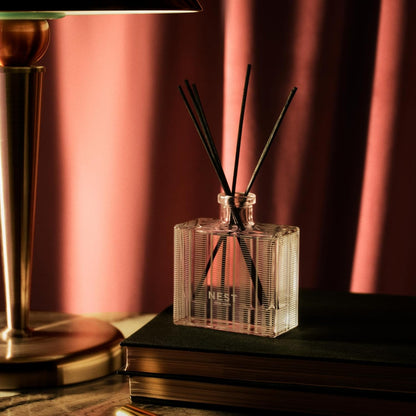 NEST New York Reed Diffuser, Moroccan Amber - 5.9 fl oz - Fragrance for Up to 90 Days - Reusable, Refillable Glass Holder - Includes 8 All-Natural Reed Sticks - Flame Free