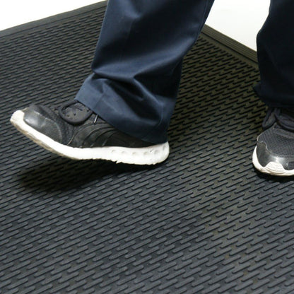 Rubber-Cal "Dura-Scraper Linear" Commercial Rubber Entrance Door Mat - 3/8 in x 3 ft x 5 ft - Black